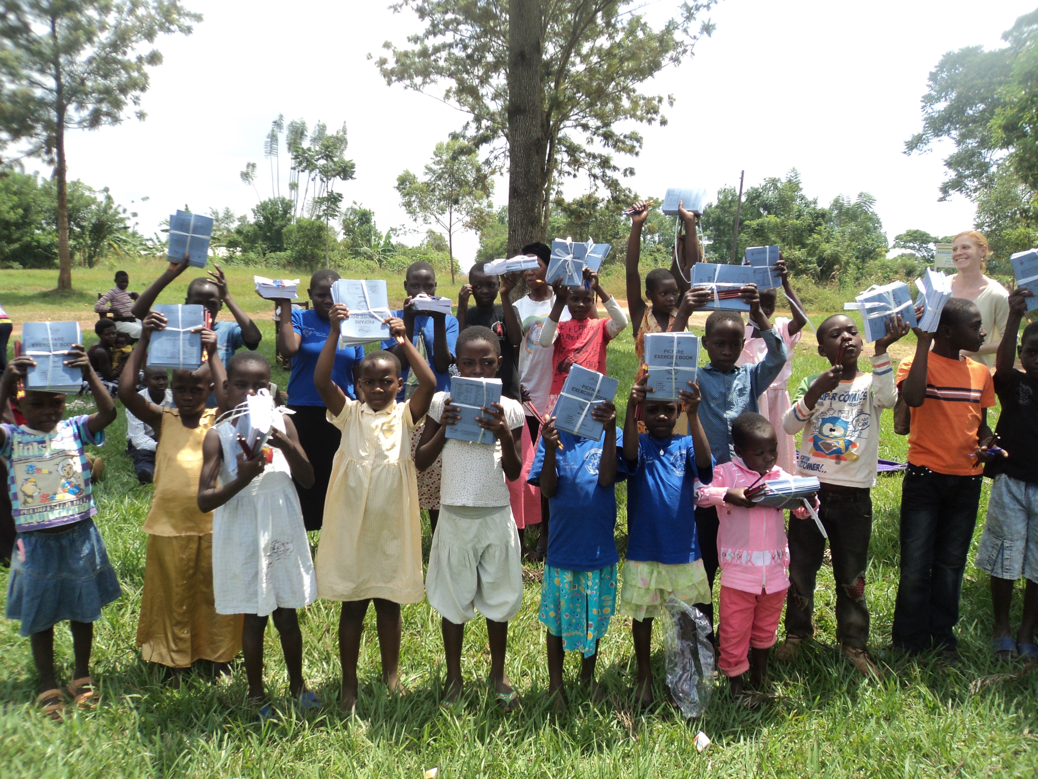 Children in school uniforms supported by LYF Uganda